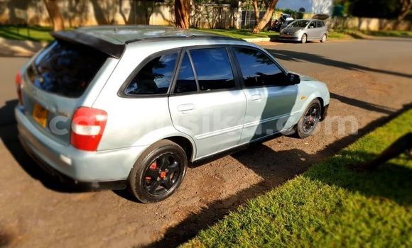 Buy Used Mazda Familia Silver Car in Alexandra Park in Harare